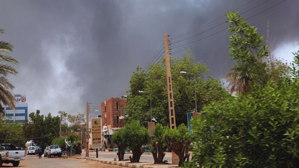 As military rivals clash, gunfire and blasts erupt around the capital of Sudan